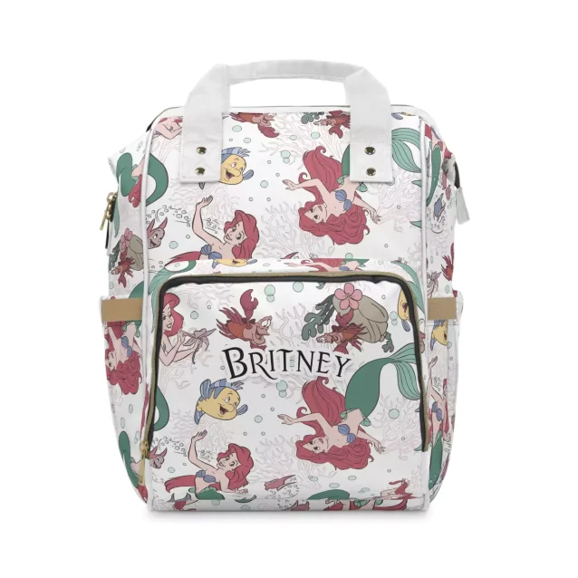 The front pocket of the Little Mermaid diaper bag with space for bottles and snacks.