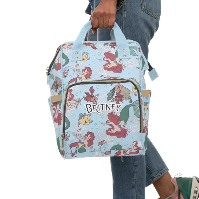 Ariel-themed diaper bag being worn by a mom, showcasing its comfortable fit.