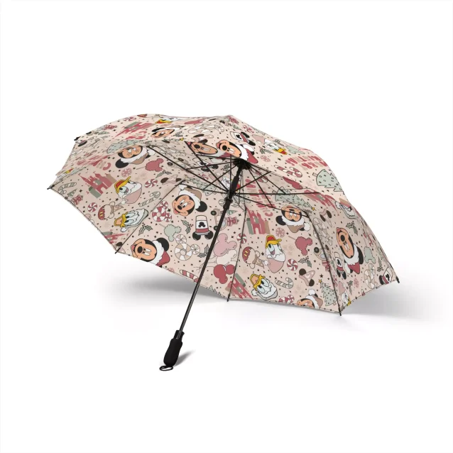 A person holding the open Mickey Christmas Mouse Umbrella, showcasing the festive design.