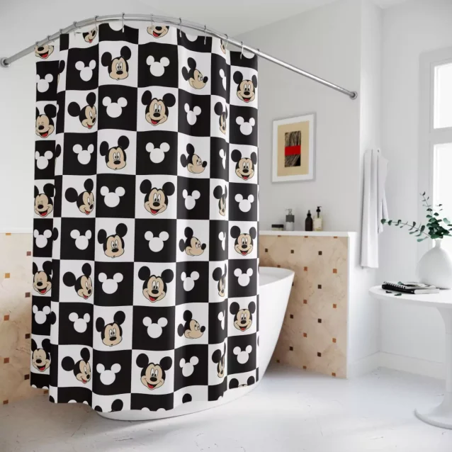 Disney's Mickey Mouse waving on a colorful striped shower curtain.