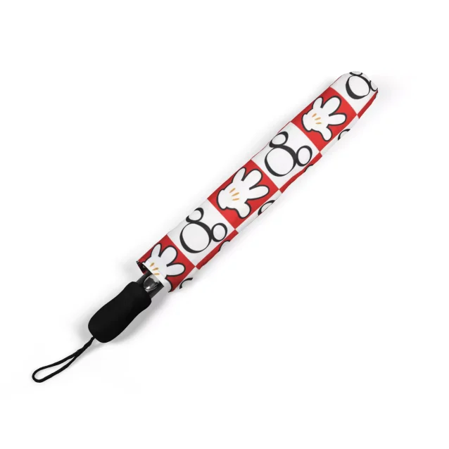 A personalized Mickey Mouse umbrella with a name embroidered on the strap.