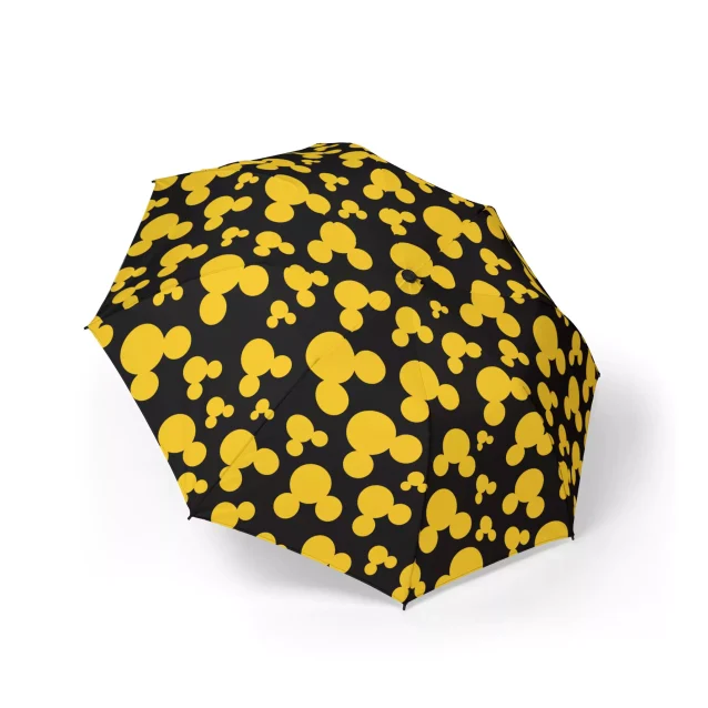 The Mickey Mouse umbrella shown in a windy condition to highlight its flexibility.