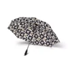 Rain beading on the waterproof canopy of the Mickey Mouse umbrella.