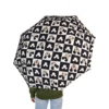 The Mickey Mouse umbrella standing open to dry after a downpour.