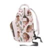Side view of the pink baby Moana nappy bag with elastic side pockets.