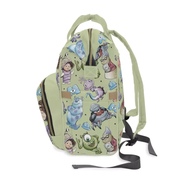 A Monsters Inc. diaper bag hanging on a stroller.