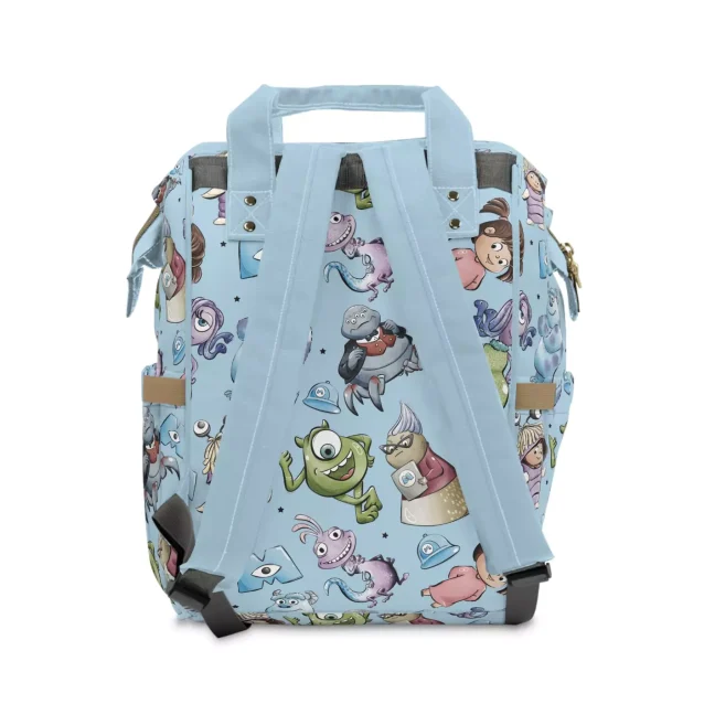 Close-up of the front pocket of the Monsters Inc. diaper bag with bottles and snacks.