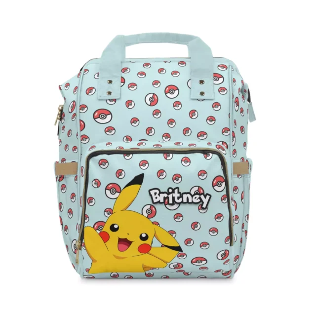 Light blue Pokemon nappy bag with Pikachu and Poké Balls, personalized with the baby's name.