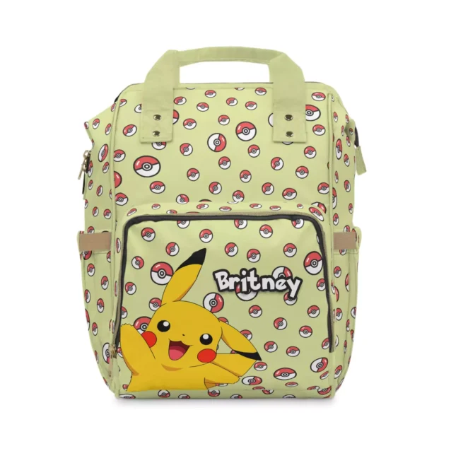 Sage green Pokemon diaper bag with Pikachu artwork and tossed Poké Balls.