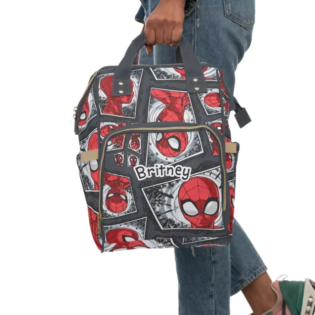 Front view of the Spiderman diaper backpack showing the web design.
