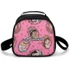 A young girl smiling while carrying her personalized Disney Princess lunch bag with an adjustable shoulder strap.