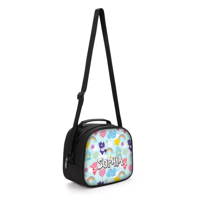 The Care Bears lunch bag shown with its adjustable shoulder strap, so a younger child can carry it across the body.