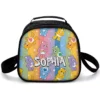 Care Bears lunch box with the bears posing across bold vertical rainbow stripes, personalized with a name.