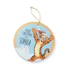 Close-up of the glossy ceramic finish on a Pooh Bear and Piglet ornament for Baby's First Christmas 2024.