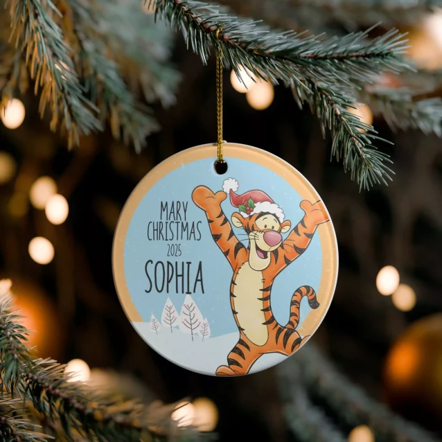 Personalized Classic Winnie the Pooh Christmas ornament with custom name shown hanging on a festive tree.