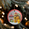 Hand holding the Super Mario Bros. Christmas ornament to show its size.