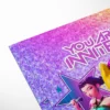 "Red and black Kpop birthday party supplies and invitation flat lay"