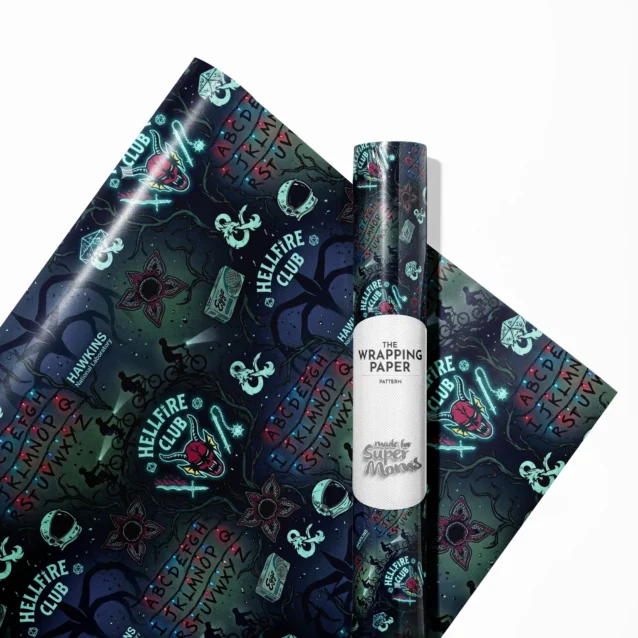 A close-up of personalized Stranger Things gift wrapping paper with a placeholder for a custom child photo upload and custom name text printed in a red 80s synth-wave font.