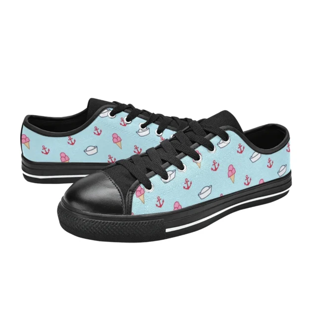 Detailed look at the nautical anchor and ice cream cone graphics on the blue canvas sneakers.