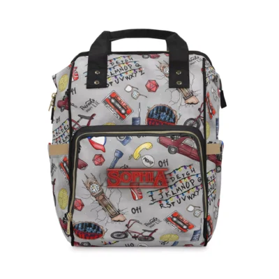 Open main compartment of nylon Stranger Things backpack filled with diapers and blankets.