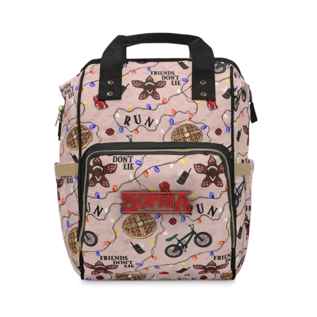 Unisex design Stranger Things bag worn by dad with baby carrier.