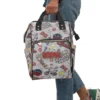 Open main compartment of nylon Stranger Things backpack filled with diapers and blankets.