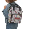 Close up of insulated front pockets in Stranger Things baby bag holding milk bottles.