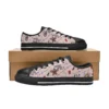 Front view of edgy black Hellfire Club canvas sneakers for kids featuring the iconic demon logo.