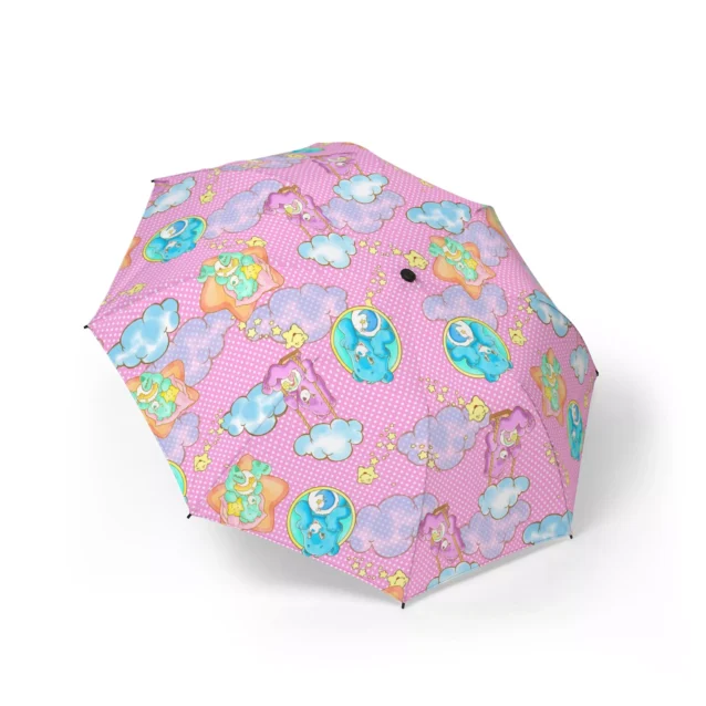 Sheltering under the Care Bears umbrella on a wet day.