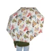Little girl holding a clear Disney Princess bubble umbrella during a rainstorm.