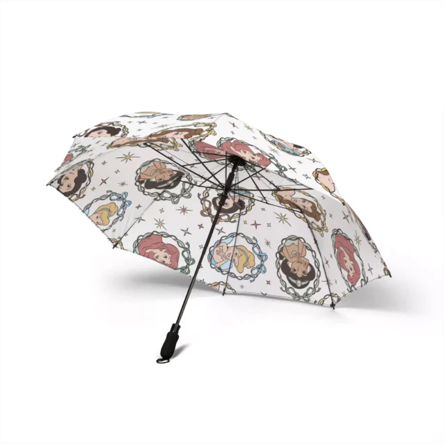 Disney Princess umbrella canopy fully open showcasing Tiana and Rapunzel graphics.