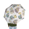 Disney Princess Princesses on White umbrella held open in the rain.