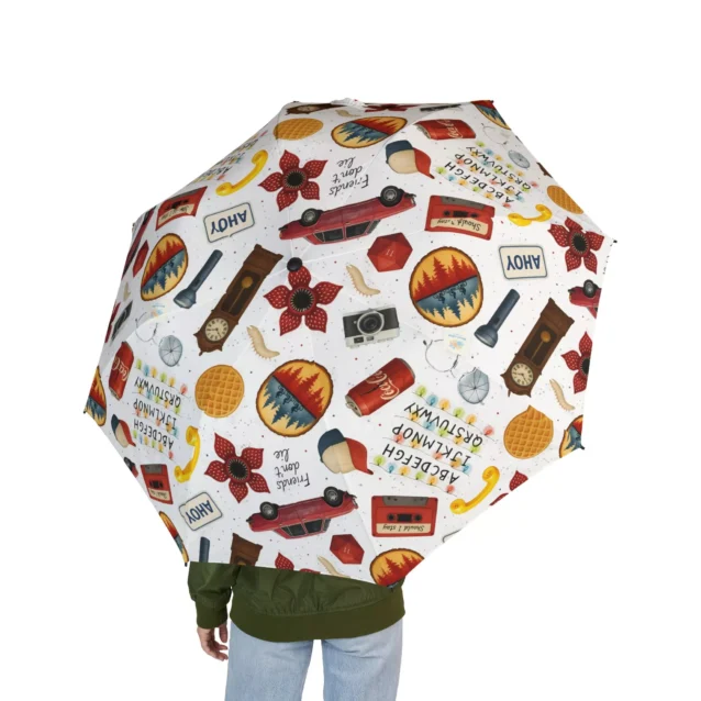 Stranger Things umbrella folded down to 7 inches showcasing its ultra-portable size.