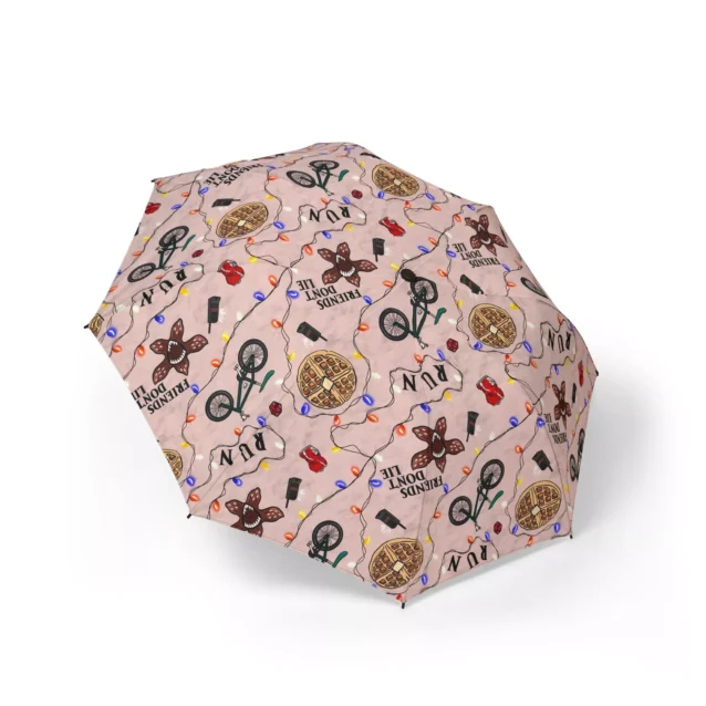 Close up of the non-slip ergonomic handle on the Stranger Things compact travel umbrella.