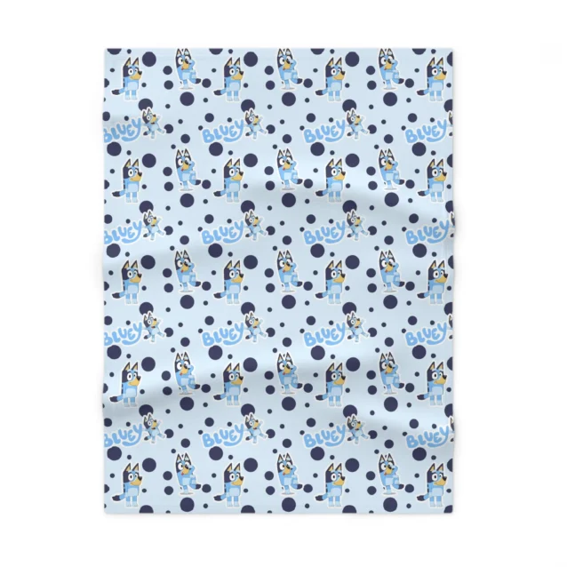 Personalized light blue Bluey nursery throw blanket showcasing custom name printing and durable double-needle stitching.