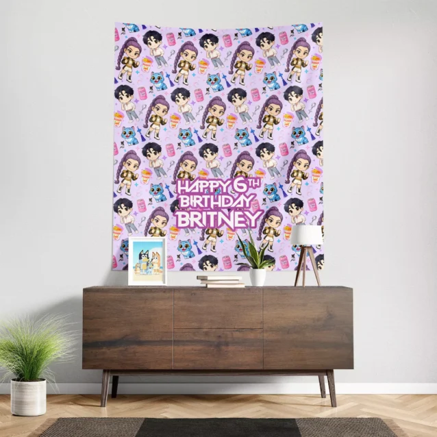Chibi style Kpop idol party tapestry in pastel purple on a living room wall.