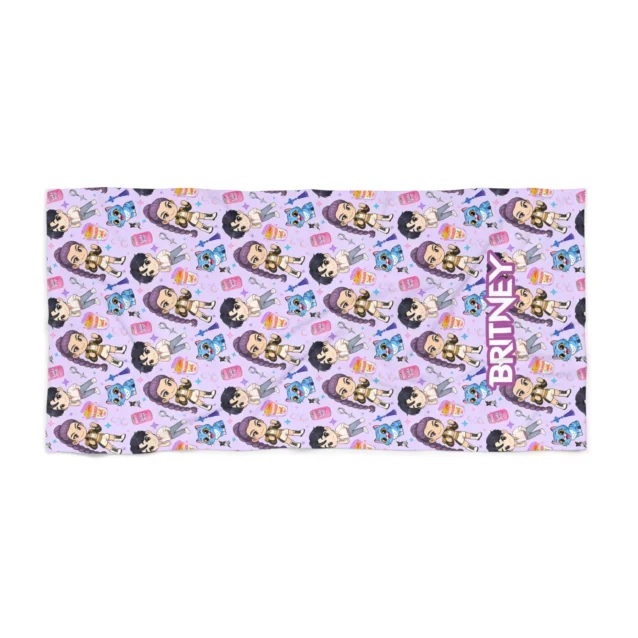Personalized Kpop beach towel laid flat on white beach sand.