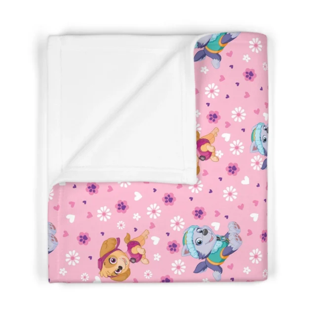 Soft pink personalized Paw Patrol nursery blanket showcasing Skye character graphics printed on plush 100% polyester fleece.