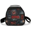 Midnight-blue Stranger Things lunch bag showing an Upside Down forest of vines and string lights with the Hawkins Middle School badge and a personalized name.