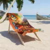 Super Mario Galaxy beach towel folded on white sand.