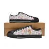 Barbie low-top canvas shoes in the white Dreamhouse doodle design with a black sole.