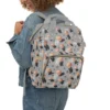 Mom wearing the grey Boss Baby diaper bag as a backpack for hands-free carrying.