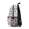 Side view of the white pastel Cars toss Lightning McQueen school backpack with mesh bottle pocket.