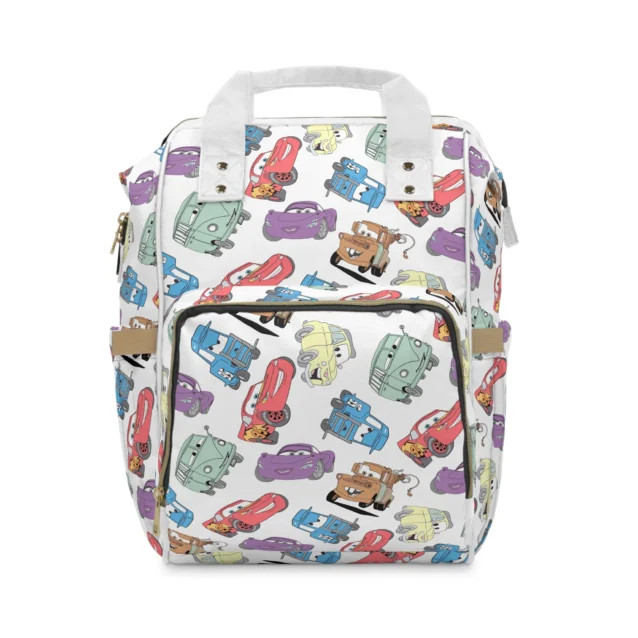 White Lightning McQueen diaper bag backpack with a pastel toss of Disney Cars characters, the baby's name printed on the front pocket.