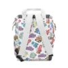 Back view of the white pastel Cars toss diaper bag showing the padded back panel and straps.
