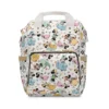 White Minnie Mouse diaper bag with Minnie dressed in Disney princess gowns.