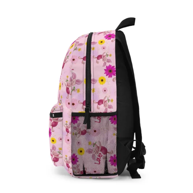 Pooh and Piglet pink floral backpack from the side, blossoms scattered across the fabric.