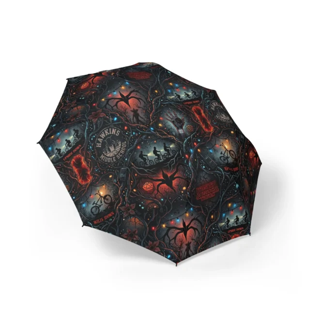 Stranger Things umbrella with the Hawkins Middle School crest and Christmas fairy lights