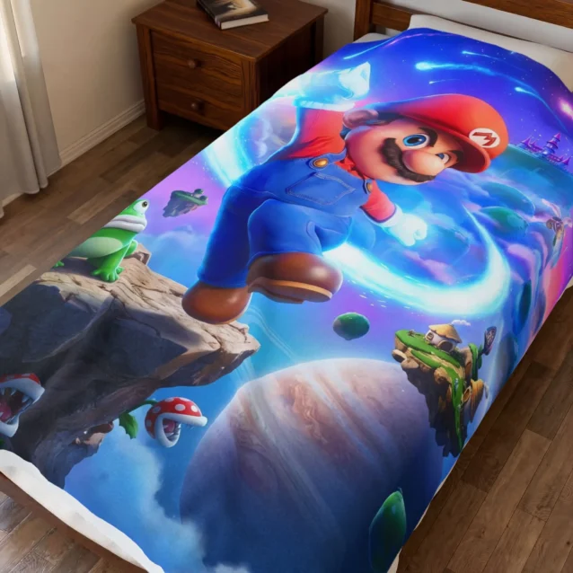 Super Mario Galaxy Blanket in the Cosmic Jump design, on a kids bed