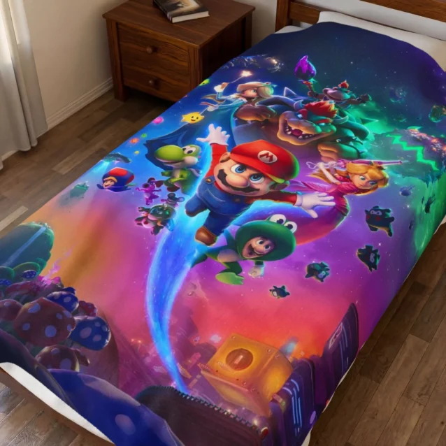 Super Mario Galaxy Blanket in the Rainbow Road Crew design, on a kids bed